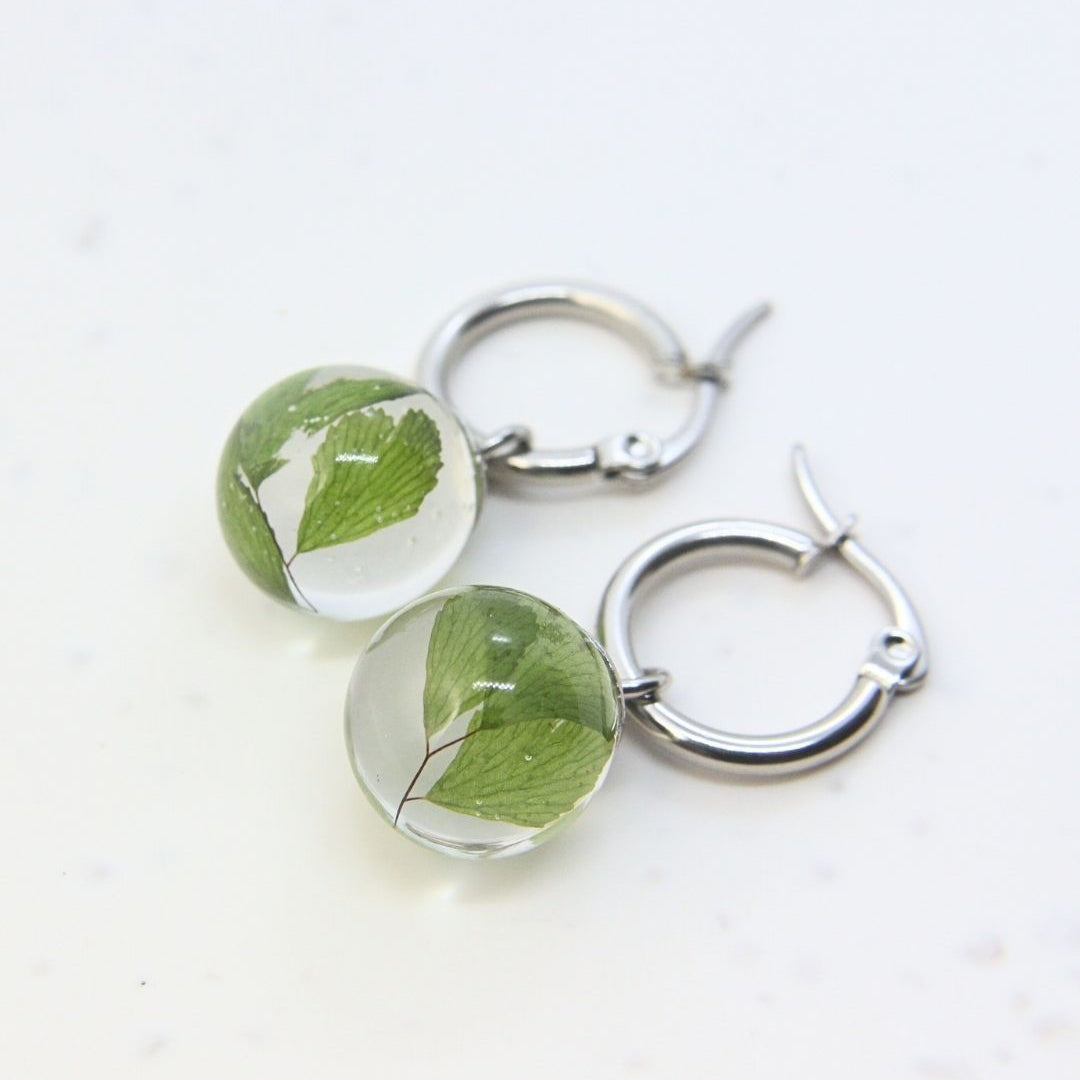Stainless steel hoop earrings with preserved South African fern leaves in resin, handmade in Cape Town — RHYN