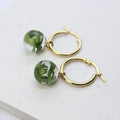 Gold plated, stainless steel, hoop earrings with preserved South African fern leaves in resin, handmade in Cape Town — RHYN