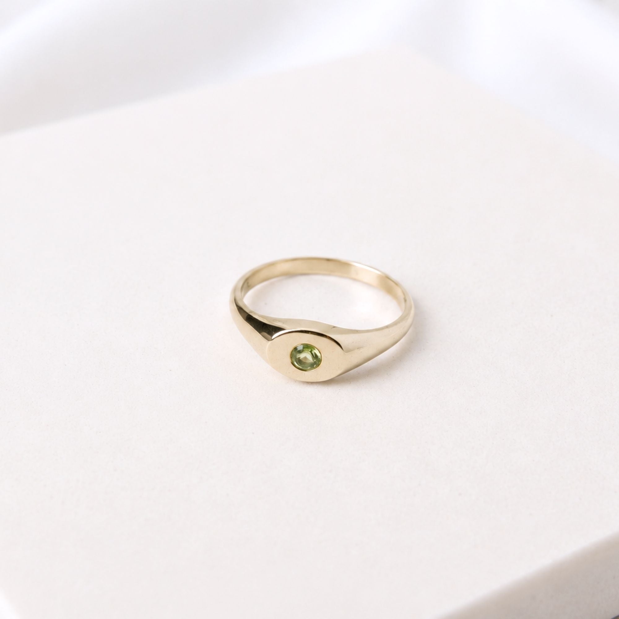 Hand-cast brass signet ring with a peridot gemstone, small-batch jewellery Cape Town — RHYN