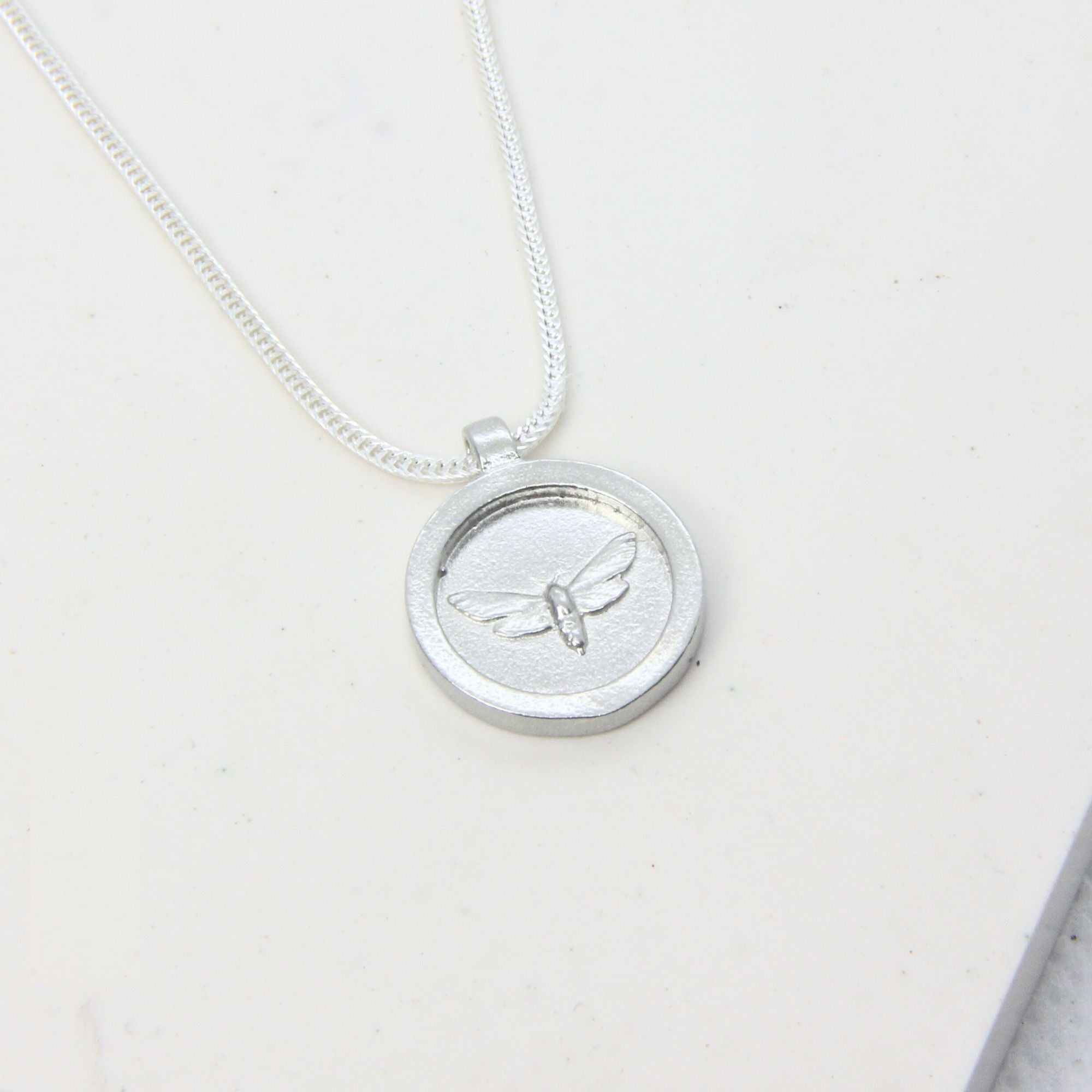 Sterling silver moth pendant disc necklace, handmade in Cape Town — RHYN