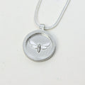 Sterling silver moth pendant disc necklace, handmade in Cape Town — RHYN