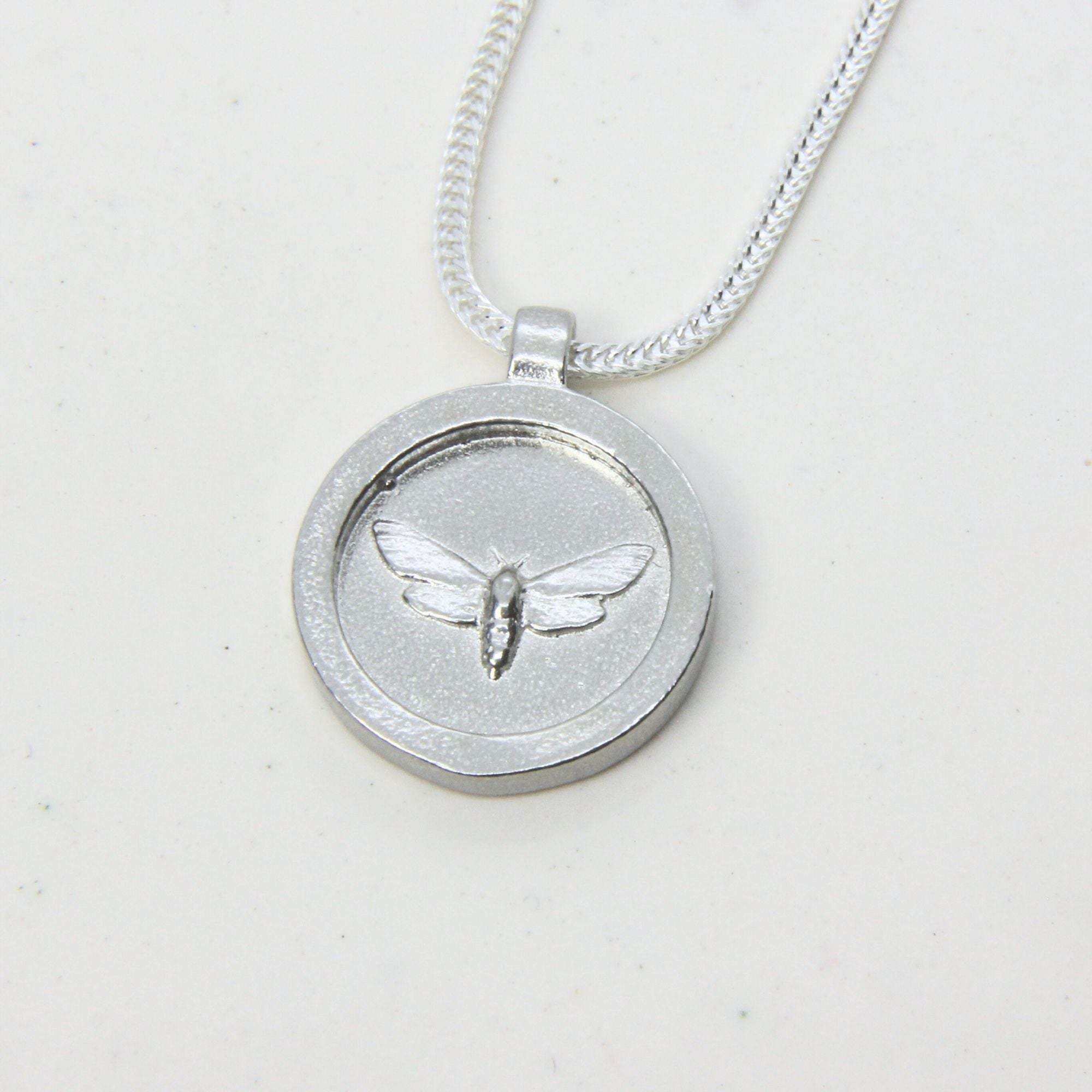 Sterling silver moth pendant disc necklace, handmade in Cape Town — RHYN