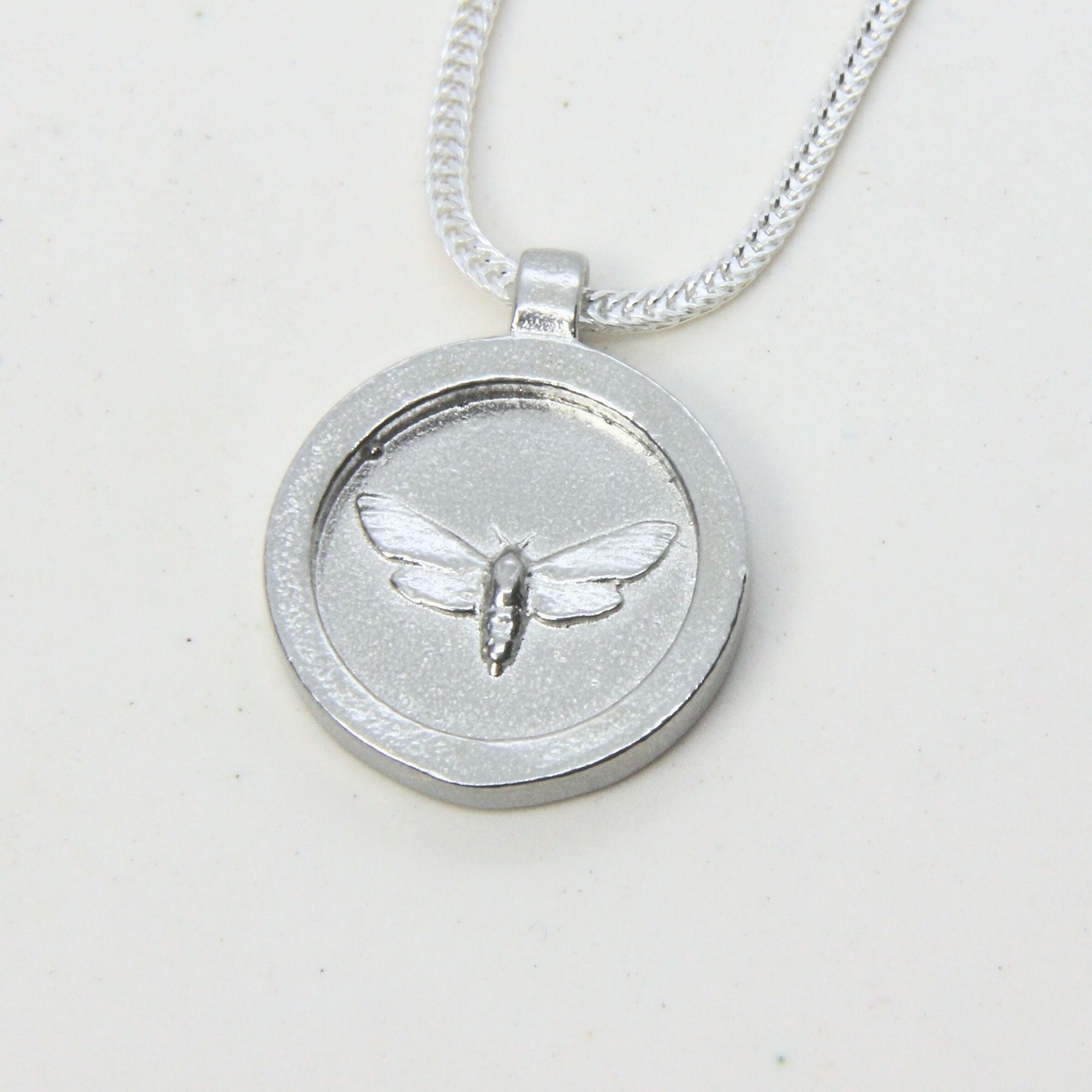 Sterling silver moth pendant disc necklace, handmade in Cape Town — RHYN