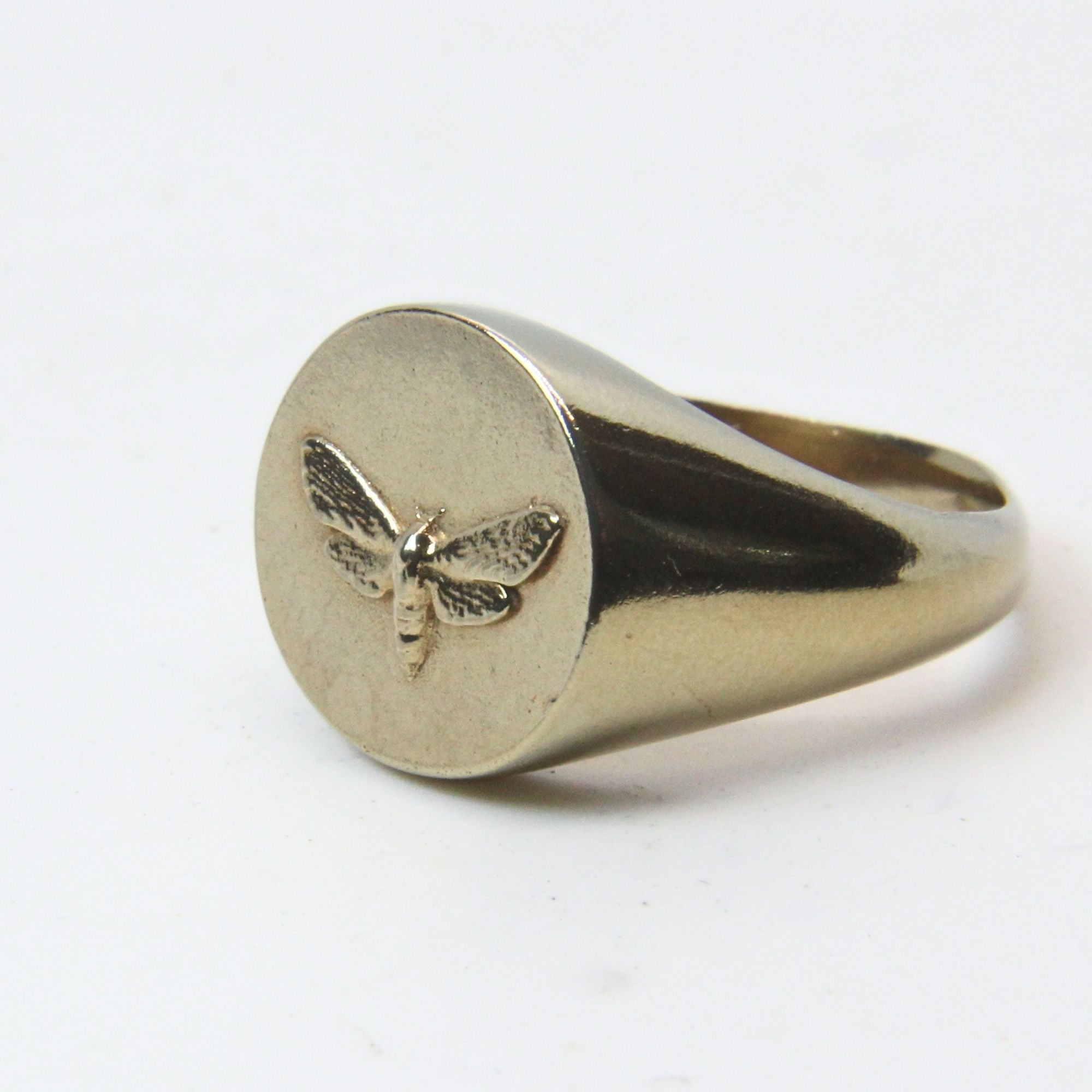 Hand-cast brass moth signet ring, small-batch jewellery Cape Town — RHYN