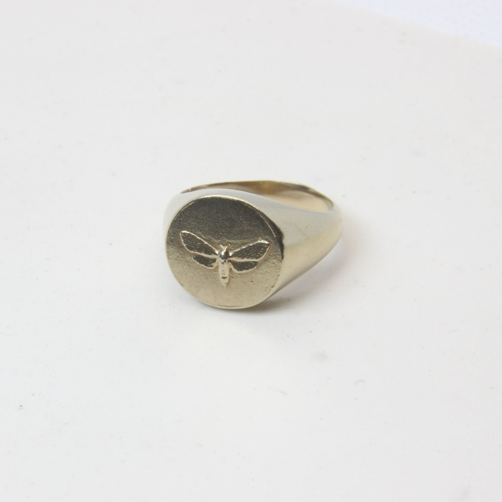 Hand-cast brass moth signet ring, small-batch jewellery Cape Town — RHYN