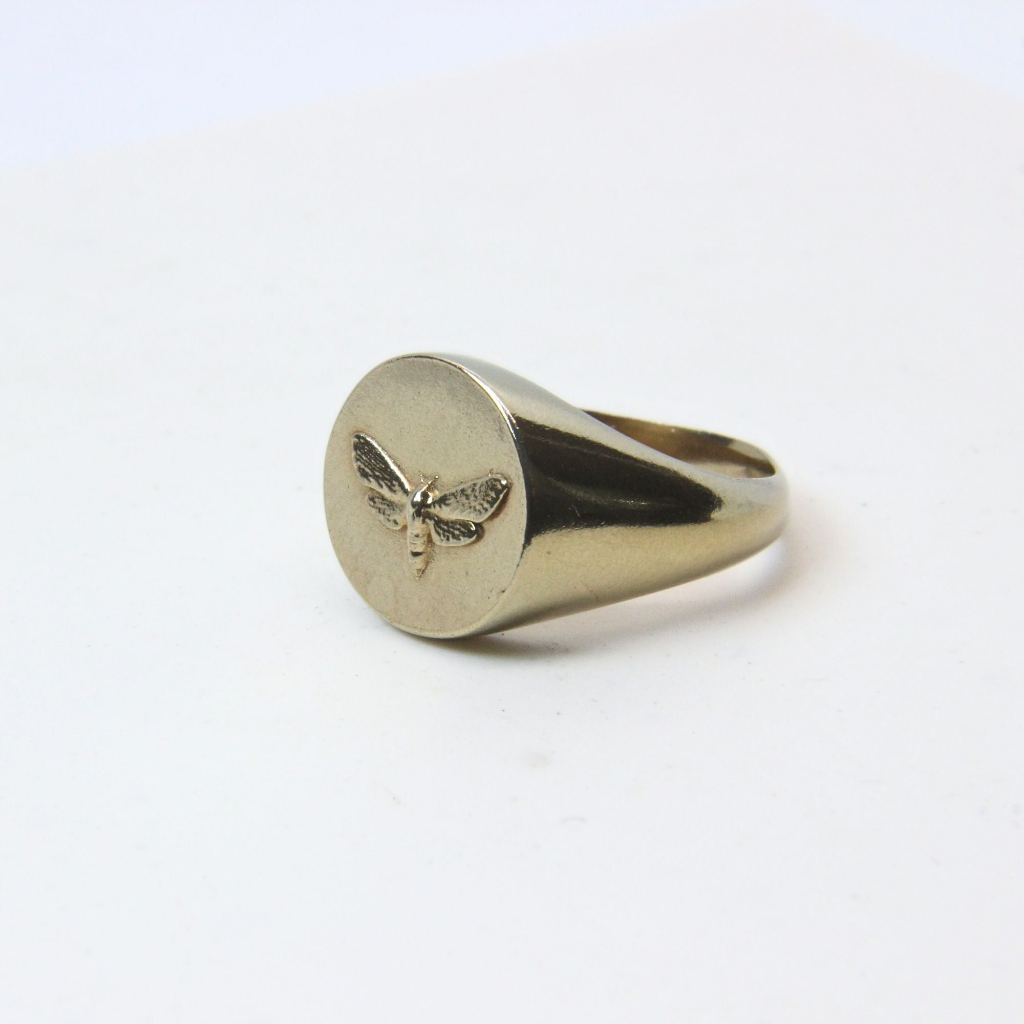Hand-cast brass moth signet ring, small-batch jewellery Cape Town — RHYN