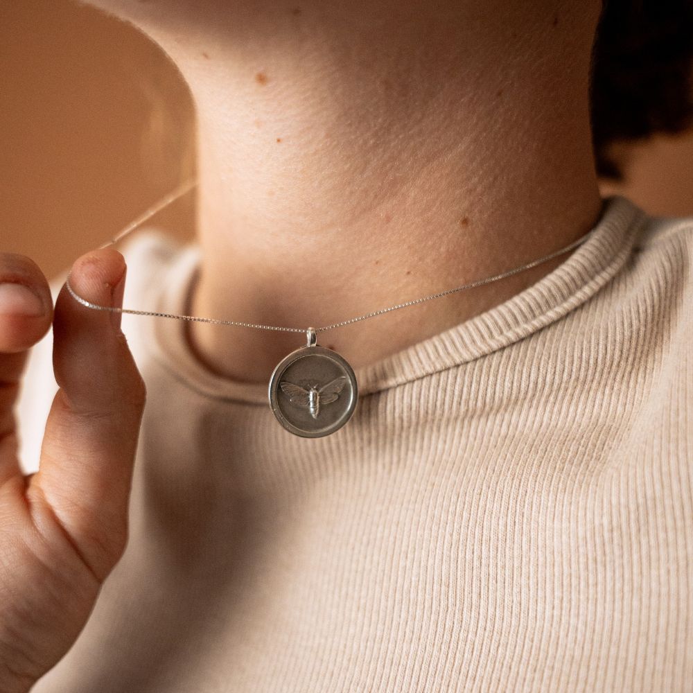 Sterling silver moth pendant disc necklace, handmade in Cape Town — RHYN